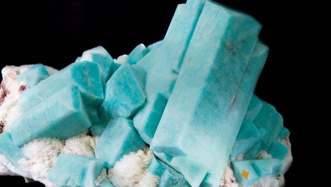 several blue crystals of intensely blue amazonite crystals arranged on a matrix of white clevelandite