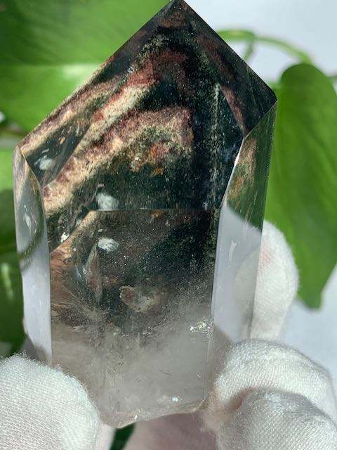 Garden Quartz lodolite polished crystal.  Lovely window clear quartz crystal with bits of chlorite and other mineral inclusions that create the illusion of a ethereal fairy world.