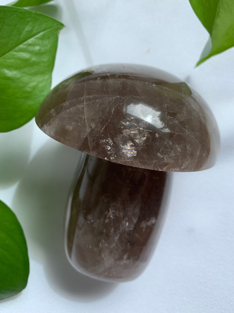 Large mushroom crystal carving of smoky quartz. Rainbow sparkles all over.