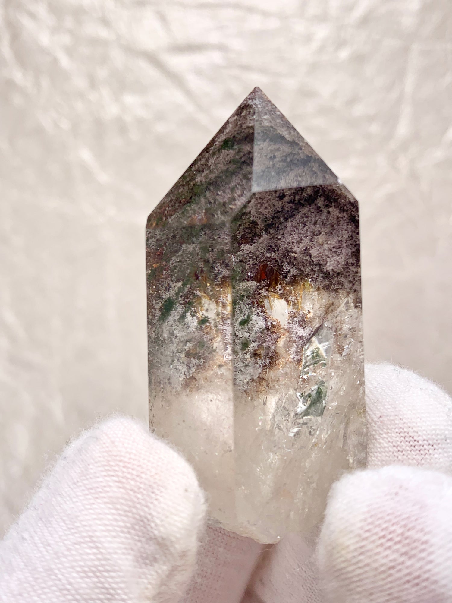 Garden Quartz lodolite polished crystal.  Lovely window clear quartz crystal with bits of chlorite and other mineral inclusions that create the illusion of a ethereal fairy world.