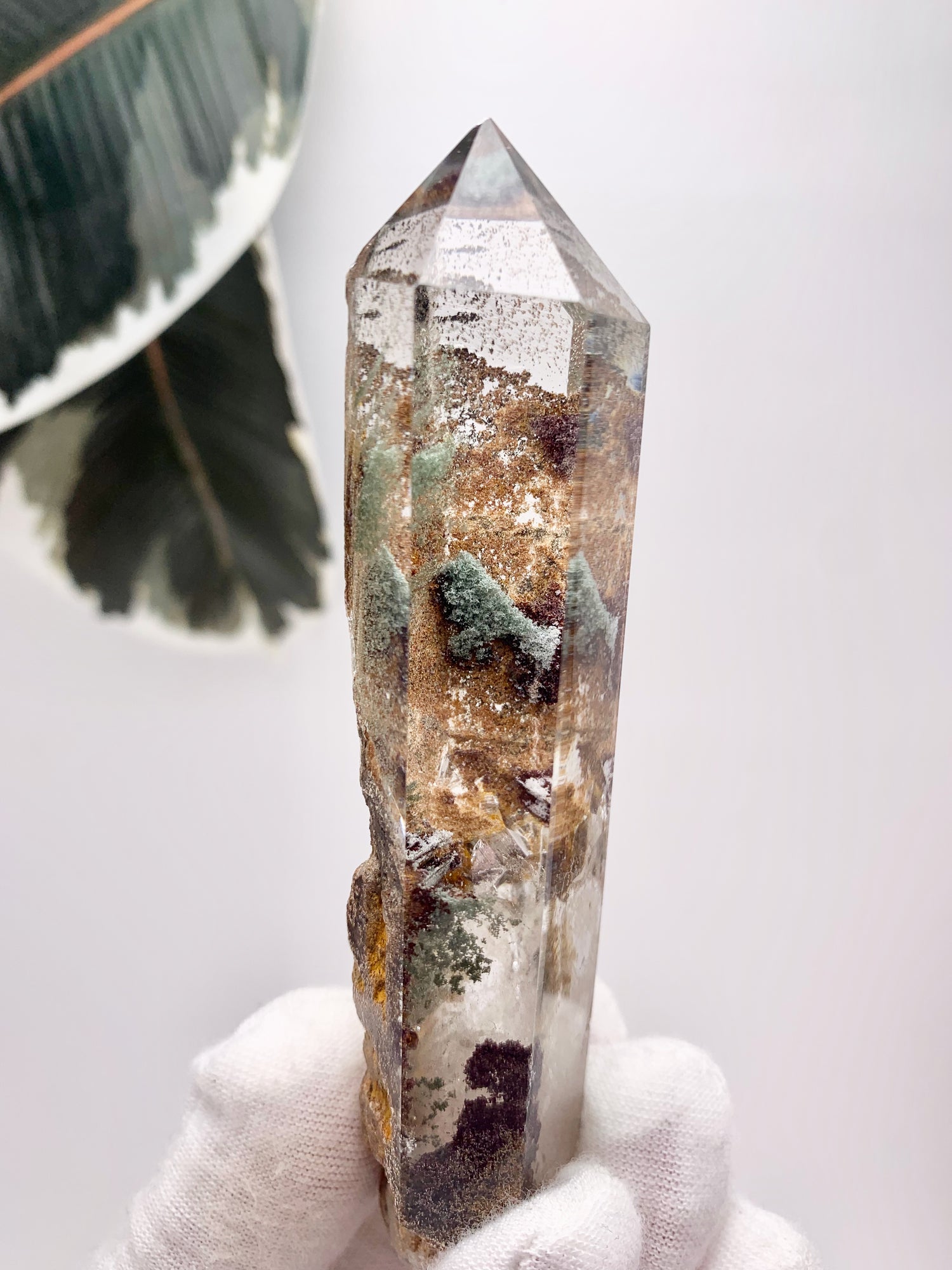 Garden Quartz lodolite polished crystal.  Lovely window clear quartz crystal with bits of chlorite and other mineral inclusions that create the illusion of a ethereal fairy world.